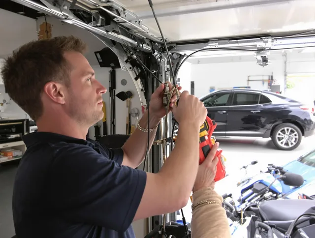 Covina Garage Door Repair safety certified technician performing cable replacement in Covina