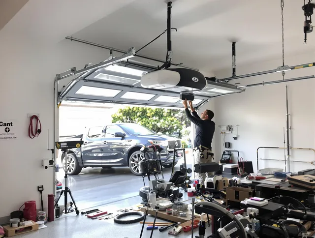 Covina Garage Door Repair specialist installing smart garage door opener system in Covina home